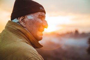 Older gentlemen outside during sunset in the winter, Hypothermia
